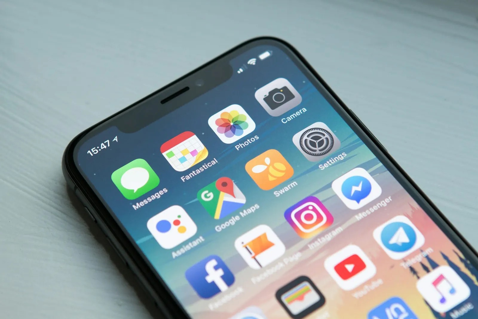 Smartphone home screen on a desk